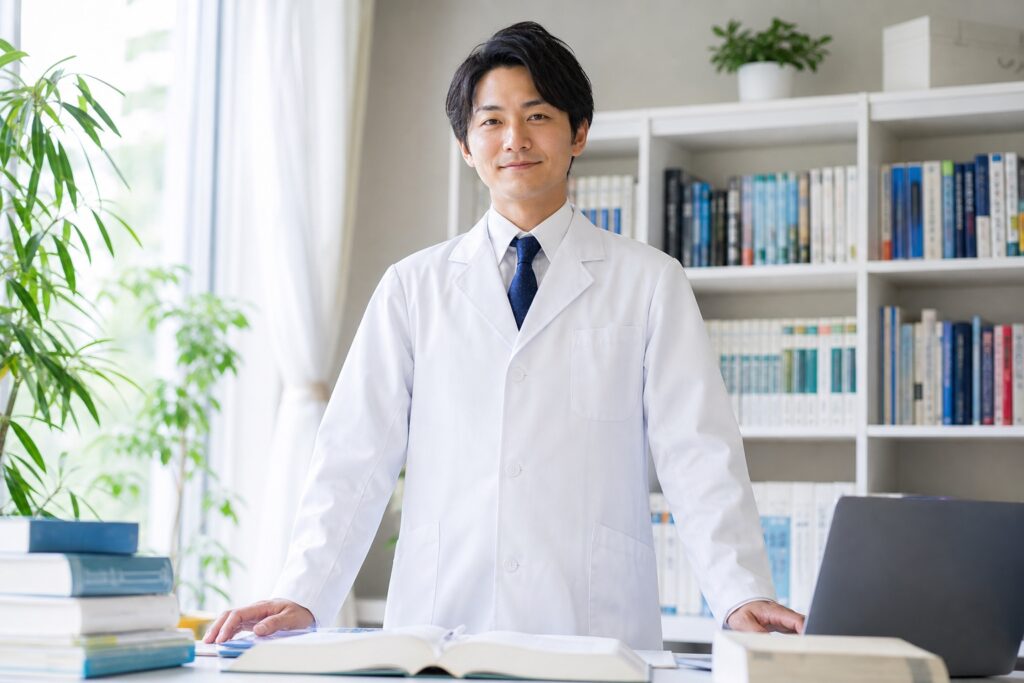専門書と資料を前に自信を持って指導する経験豊富な家庭教師